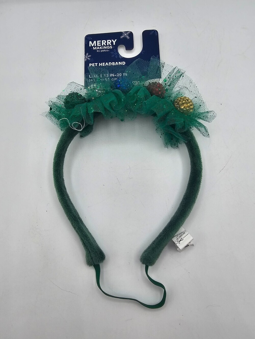 Merry Makings green pet headband adorned with tinsel and small ornaments